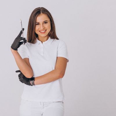 Female dentist with dentistry tools isolated